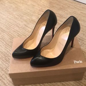 Christian Louboutin pumps.